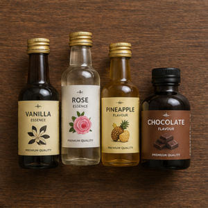 Bottles of baking essences and flavours on a dark wooden surface